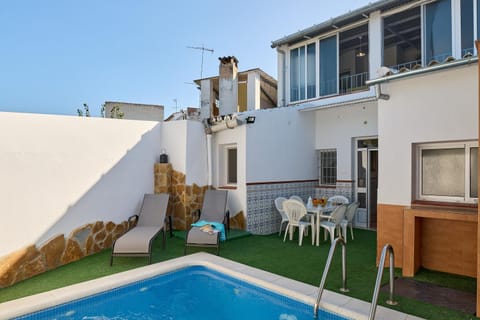 Property building, Living room, Swimming pool