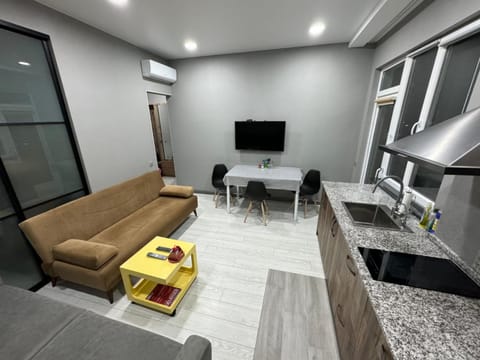 TV and multimedia, Kitchen or kitchenette, Living room, Seating area, Dining area, air conditioner