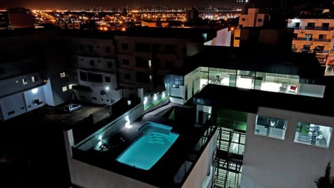 Property building, Night, Bird's eye view, View (from property/room), Balcony/Terrace, City view, Pool view, Swimming pool