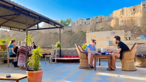 Property building, Restaurant/places to eat, People, View (from property/room), Balcony/Terrace, Dining area, Guests, group of guests