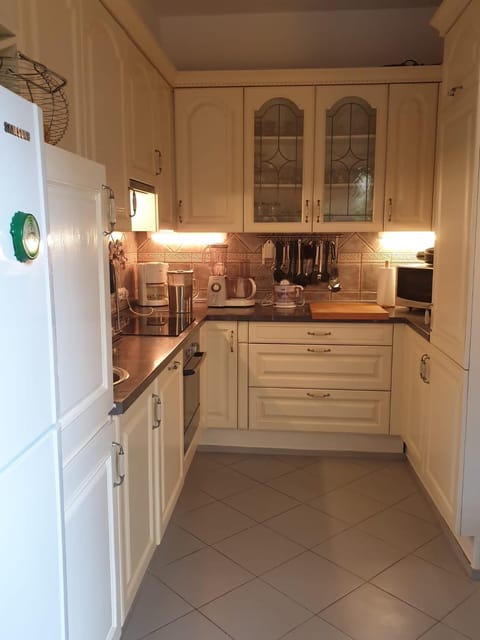 Kitchen or kitchenette, dishwasher, oven, stove