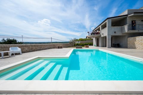 Property building, Patio, Pool view, Swimming pool, sunbed