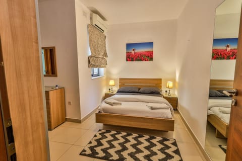 Bedroom, towels, wardrobe, air conditioner