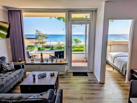 View (from property/room), Balcony/Terrace, Living room, Seating area, Lake view, Sea view