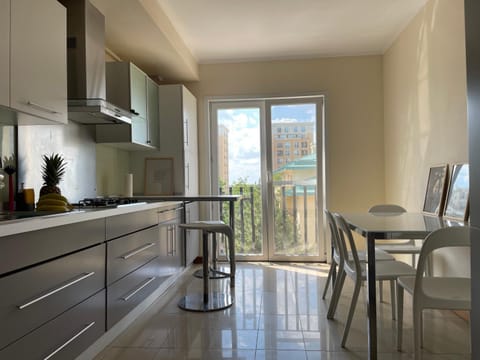 Pool view, dishwasher, microwave, oven, stove, kitchen