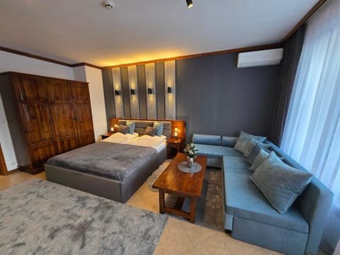 Bed, Living room, Decorative detail, Seating area, Bedroom, air conditioner