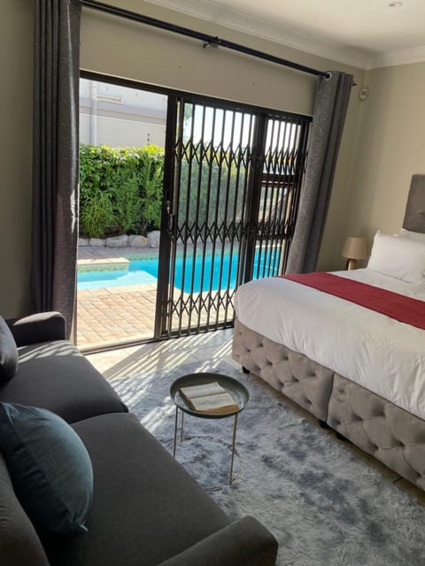 Bed, Seating area, Bedroom, Pool view