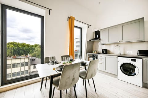 Kitchen or kitchenette, Dining area, oven, stove, washing machine, kitchen