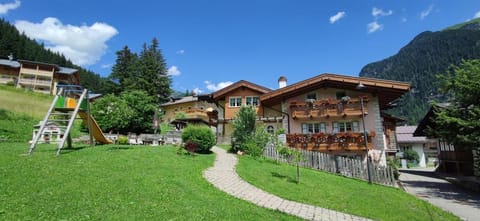 Property building, Spring, Day, Natural landscape, Garden, Garden view, Mountain view