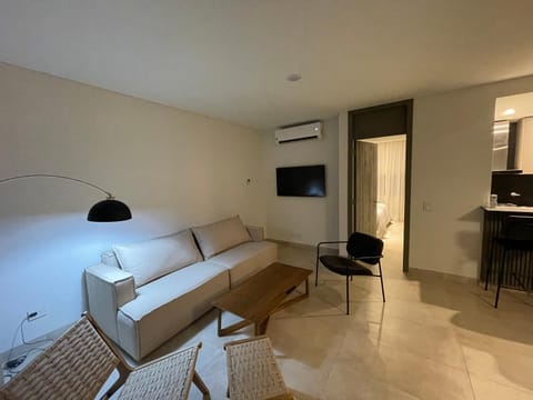 Bed, TV and multimedia, Living room, Seating area, Evening entertainment, air conditioner