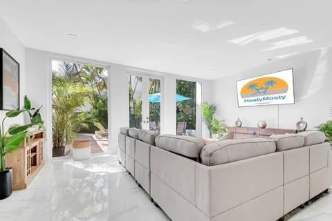 Property logo or sign, TV and multimedia, Living room, Seating area, Logo/Certificate/Sign, Text overlay, Certificate/Award