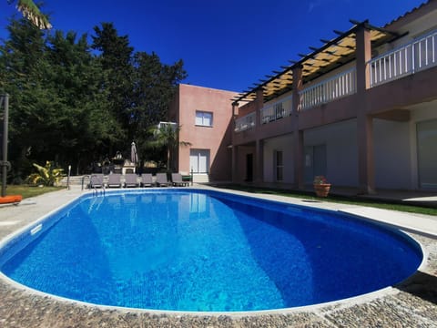 Property building, Pool view, Swimming pool, sunbed