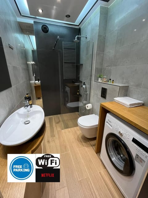 Shower, Toilet, Bathroom, towels, washing machine, dryer