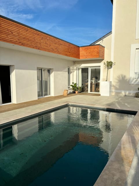 Property building, Patio, Pool view, Swimming pool, sunbed