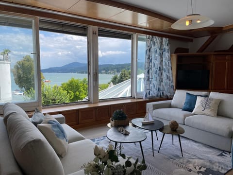 Natural landscape, View (from property/room), Living room, Seating area, Lake view, Mountain view