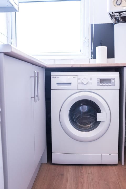 Kitchen or kitchenette, washing machine
