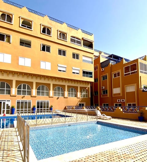 Property building, Pool view, Swimming pool, sunbed