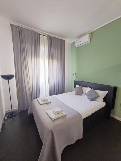 Bed, Photo of the whole room, Bedroom, towels, air conditioner