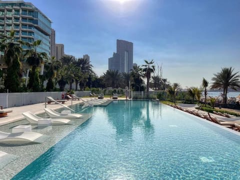 Property building, Day, Pool view, Swimming pool, sunbed