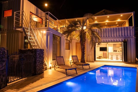 Property building, Patio, Night, Balcony/Terrace, Pool view, Swimming pool