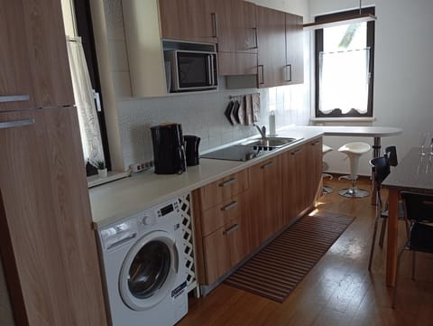 Kitchen or kitchenette, dishwasher, stove, washing machine