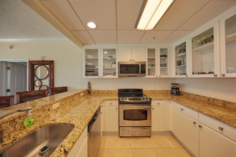 Kitchen or kitchenette, dishwasher, oven, stove