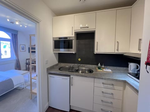 Kitchen or kitchenette, stove
