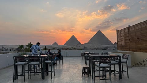 Restaurant/places to eat, Day, People, Activities, View (from property/room), Banquet/Function facilities, City view, Landmark view, Mountain view, Sunrise, Sunset, group of guests