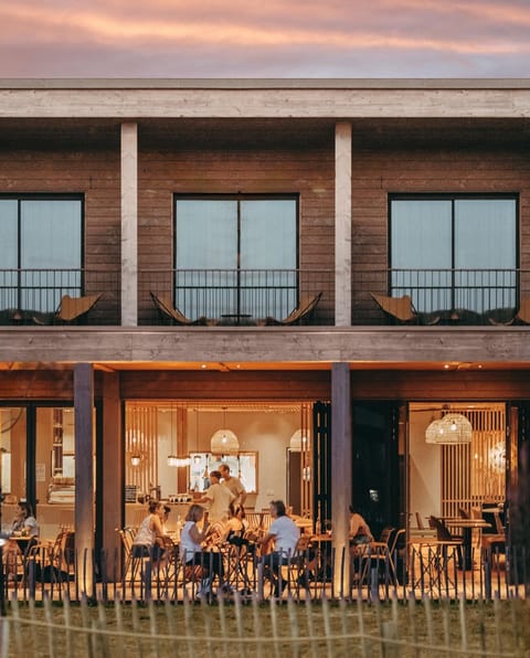 Property building, Patio, Restaurant/places to eat, People, Seating area