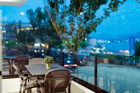 Patio, Nearby landmark, Night, Natural landscape, View (from property/room), Living room, Seating area, Beach, City view, Landmark view, Pool view, Sea view, Sea view, Swimming pool, Parking