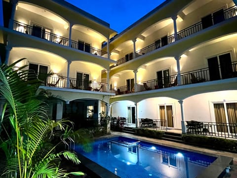 Property building, Patio, Night, Balcony/Terrace, Pool view, Swimming pool