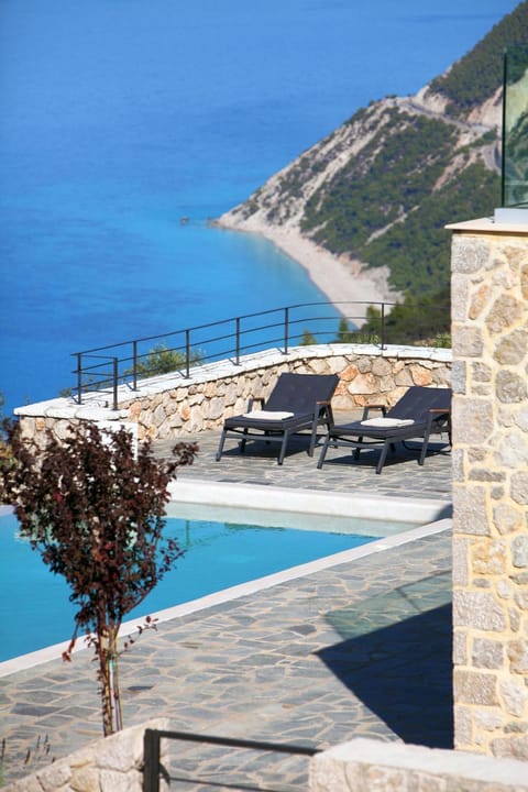 Property building, Patio, Natural landscape, Sea view, Swimming pool