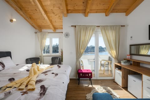 Bed, TV and multimedia, Living room, Seating area, Bedroom, hair dresser