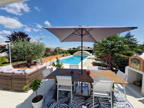Property building, Patio, Day, View (from property/room), Balcony/Terrace, Living room, Seating area, Dining area, Pool view, Swimming pool, sunbed