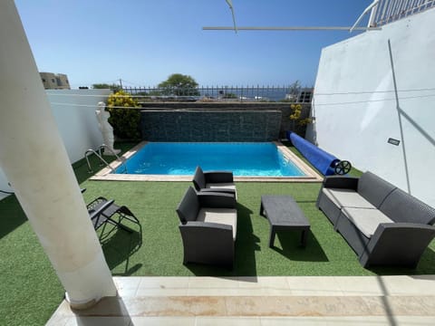 Patio, Sea view, Swimming pool, sunbed