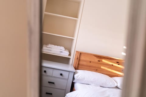 Bed, towels, wardrobe