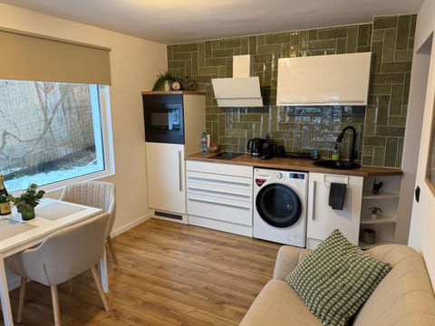 Living room, Seating area, Dining area, microwave, stove, dryer