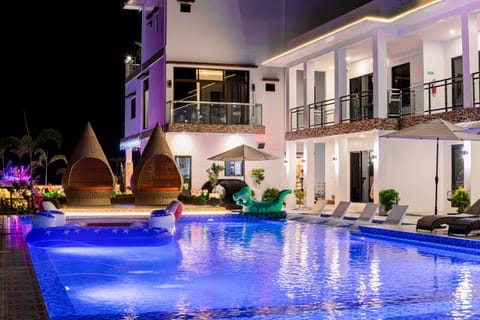 Property building, Patio, Night, Pool view, Swimming pool