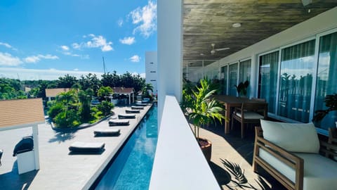 Property building, Patio, Day, BBQ facilities, View (from property/room), Balcony/Terrace, Living room, Seating area, Swimming pool, sunbed