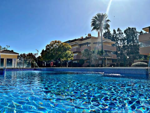Property building, Day, Pool view, Swimming pool, sunbed