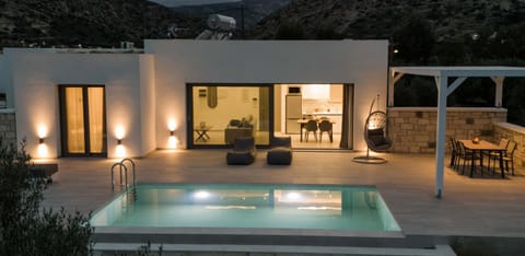 Property building, Patio, Night, Natural landscape, Mountain view, Pool view, Swimming pool, sunbed