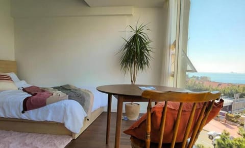 Bed, Natural landscape, View (from property/room), Living room, Seating area, Bedroom, Sea view