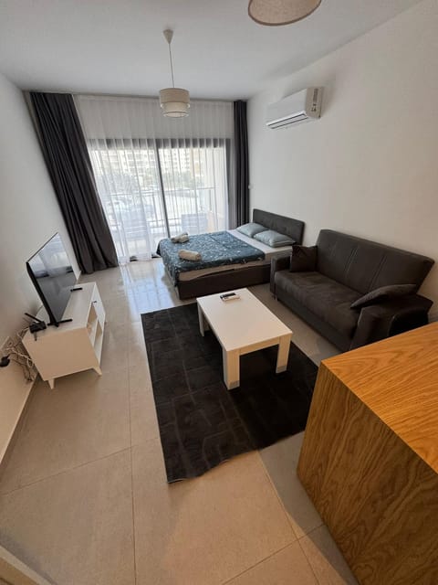 Bed, TV and multimedia, Seating area, Bedroom, air conditioner