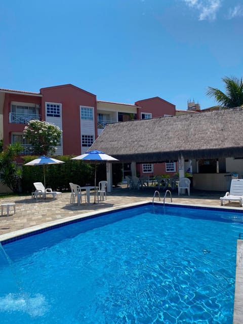 Property building, Day, Pool view, Swimming pool, sunbed