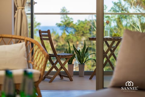 Day, Natural landscape, View (from property/room), Balcony/Terrace, Living room, Decorative detail, Decorative detail, Seating area, Logo/Certificate/Sign, Sea view