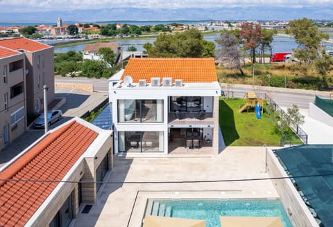 Property building, Day, Natural landscape, Bird's eye view, Pool view, Sea view, Swimming pool, sunbed