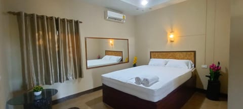 Bed, Photo of the whole room, Bedroom, towels, air conditioner