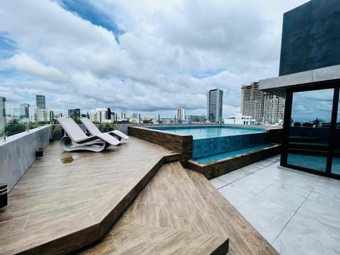Property building, Patio, Day, Balcony/Terrace, Seating area, City view, Pool view, Swimming pool, sunbed