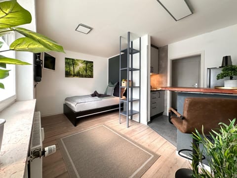 Communal lounge/ TV room, Bed, TV and multimedia, Living room, Photo of the whole room, Seating area, Evening entertainment, Bedroom