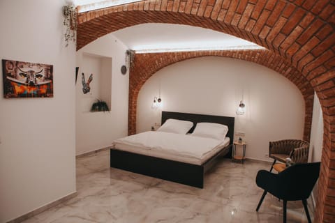 Bed, Seating area, Bedroom